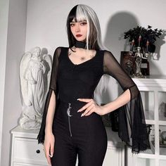 When Darkness Comes Top. This sheer mesh top has flared bell sleeves and a collar neckline with a back closure and a front cutout. Product Details Black Polyester, Spandex Size Guide Size Chest Waist Sleeve Length S 77 64 70 M 81 69 71 L 85 73 72 Unit: cm NOTE: 1. Please strictly follow the size chart to select the size. Do not select directly according to your habits. 2. The size may have 2-3cm differs due to manual measurement. Please note when you measure How to Measure To choose the correct Alternative Long Sleeve Mesh Tops, Sheer Tops For Alternative Fashion, Black Fitted Mesh Top For Halloween, Fitted Black Mesh Top For Halloween, Black Sheer Mesh Top Gothic Style, Long Sleeve Mesh Top Punk Style, Edgy Sheer Tops For Alternative Fashion, Long Sleeve Mesh Top In Punk Style, Gothic Fitted Top With Sheer Sleeves