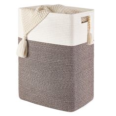 the large storage basket has a tasselled handle