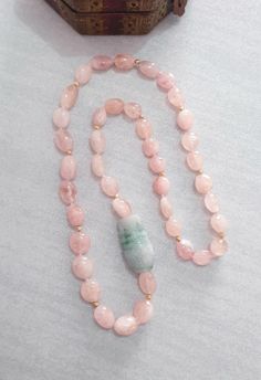 "Pink Morganite Long Necklace with  Garde A Burma Jade Vase Carving Bead Necklace Length: 29\" Morganite Beads : Assorted Size  Green Jadeite Carved Bead : 40x25mm  The necklace is made by natural morganite and Grade A Green Jade hand carved bead.  All the beads are hand knotted with silk thread. The carving is absolutely beautiful and attractive. And it is easy to wear in any occasion.  It will be a special gift for your loved one. All jewelry comes with Kennaries jewellery signature gift bag. Please feel free to message me if you want to see more photos or make any modifications on the necklace. Free worldwide shipping P.S the color of the stone may vary from monitor to monitor. Please note there is no photo editing used on any photos." Pink Rondelle Beaded Necklace As Gift, Pink Hand-strung Necklace As Gift, Pink Hand-strung Necklace For Gift, Jade Single Strand Beaded Necklace Gift, Jade Beaded Single Strand Necklace Gift, Single Strand Jade Beaded Necklaces As Gift, Pink Necklace With Round Beads For Mother's Day, Pink Round Bead Necklaces For Mother's Day, Pink Beaded Necklaces For Mother's Day