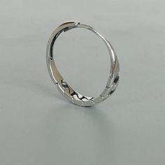 A free size sterling silver ring with a gourmette design. SIZE: 1.3mm x 3mm x 17mm as sold ( It is open ended and can be adjusted to fit most fingers) WEIGHT: 1.07 gm This ring is made of 925 hypoallergenic sterling silver. Most of my pieces come with a 925 stamp. Can be packaged in a gift box. I can include a personal message from you if needed You are welcome to contact me at... bhavnakwintra1956@gmail.com For more beautiful pieces from my shop, please browse 👇 TOE RINGS: https://www.etsy.com Trendy Stackable Sterling Silver Jewelry, Sterling Silver Hoop Jewelry With A Modern Twist, Modern Hoop Rings Tarnish Resistant, Modern Twist Sterling Silver Hoop Jewelry, Silver Circle Fine Jewelry, Fine Silver Circular Jewelry, Modern Twist Silver Hoop Jewelry, Modern Twist Sterling Silver Open Ring Jewelry, Silver Minimalist Stackable Jewelry