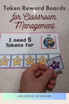 a hand holding up a card that says token reward boards for classroom management i need 5 tokens for