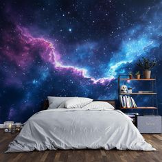 a bed in a room with a large wall mural