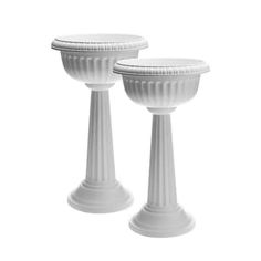 two white pedestals sitting next to each other