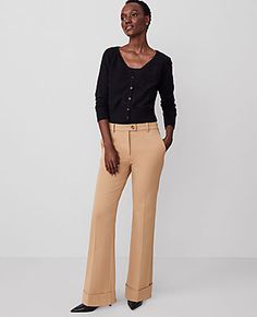 The versatile, streamlined look is back - our cuffed trouser pant is ultra flattering. Front zip with extended button tab closure. Front off-seam pockets. Back besom pockets.,Leg Shape:Trouser – a pant with a bit of flare that lengthens legs,Rise:High rise: sits 1/2" to 1" below natural waist,Imported:Imported,Fit:Tailored & fitted,Length:Full length: 31 1/2" inseam with 22" leg opening,Fabrication:64% Polyester, 31% Viscose, 5% Elastane,Garment Care:Machine Washable The Cuffed Tab Waist Trouser Formal Pants With Button Cuffs For Fall, Classic Fall Bottoms For Workwear, Tailored Bottoms With Button Cuffs For Office, Tailored Bottoms With Button Closure For Fall, Chic Workwear Pants With Button Cuffs, Tailored Fall Bottoms With Button Closure, Chic Button Cuffs Pants For Workwear, Chic Pants With Button Cuffs For Business Casual, Chic Pants With Button Cuffs For Work