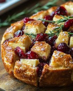 a cranberry and rosemary bread dish on a cutting board