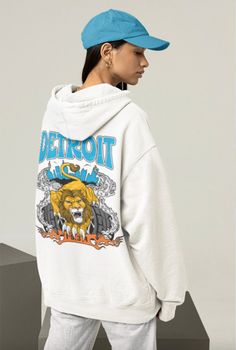 Represent Detroit football in this groovy vintage hoodie. Featuring eye-catching prints on both the front and back, this hoodie makes a statement whether you're coming or going. Perfect for showcasing your game day pride! We are proud to present you with high-quality hoodies and use the Independent Trading Co. SS4500 hooded sweatshirt - Unisex. Made from an 80% - 20% cotton/polyester blend, it strikes the perfect balance between cozy and stretchy. Hoodie Details - 80% cotton, 20% polyester fleec Hoodie Details, Vintage Detroit, Lions Football, Quality Hoodies, Hoodie White, Vintage Hoodie, Retro Football, Vintage Hoodies, Cool Vintage