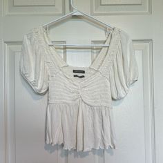 White Urban Outfitters Brand Top That Looks Like A Milkmaid Style With Little Poofy Sleeves. Never Worn! Very Cute, Just Not My Style. Looks Like It Would Do Well As An Under Layer For A Renaissance Fair Outfit Too! Urban Outfitters White V-neck Tops, White V-neck Blouse With Smocked Bodice, Urban Outfitters V-neck Summer Blouse, Urban Outfitters Short Sleeve Summer Blouse, Fitted V-neck Peasant Top Casual, Fitted V-neck Peasant Top, Urban Outfitters White Spring Blouse, Chic Cream Tops From Urban Outfitters, Chic Cream Tops By Urban Outfitters