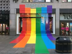 there is a rainbow painted building on the street