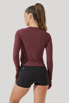 From street to studio, every wardrobe needs an anywear kind of basic. Made from our lightweight plant-based fabric, this long-sleeved tee pairs seamlessly with your fav pair of jeans or leggings-of-choice. And, it has thumbholes! Performance Level: High Stretch Casual Long Sleeve Top For Layering, Fall Stretch Long Sleeve Top In Athleisure Style, Fall Stretch Long Sleeve Athleisure Top, Versatile Long Sleeve Everyday Activewear, Basic Long Sleeve Stretch Activewear, Basic Stretch Long Sleeve Activewear, Everyday Athleisure Tops With Thumbholes, Versatile Stretch Long Sleeve Top For Everyday, Basic Long Sleeve Activewear For Workout