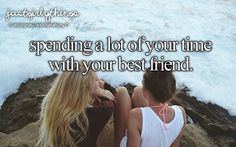 two young women sitting on the rocks looking at the ocean and saying, spending a lot of your time with your best friend