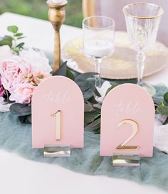 the table numbers are pink and gold