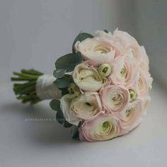 a bridal bouquet with white and pink flowers