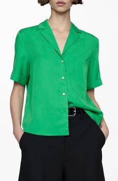 The perfect meeting of laid-back casual and styled-up polish, this camp shirt crosses the line in a fluid, drapey fabric both parties can agree on. Front button closure Notched collar Short sleeves 100% lyocell Machine wash, line dry Imported Summer V-neck Workwear Shirt, Spring Green Relaxed Fit Camp Shirt, Green Spring Camp Shirt, Classic Summer Blouse In Viscose, Classic Short Sleeve Viscose Blouse, Green Collared Camp Shirt For Spring, Spring Blouse With Camp Collar, Spring Green Tops With Camp Collar, Green Camp Collar Blouse For Spring