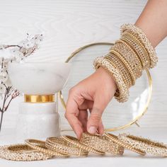 Beautify your traditional look with an elegant set embodying culture and style! This luxurious bridal bangle set is designed with exquisite gajra bangles and champagne stones that will make you sparkle with beauty on your big day. Available in various sizes. Gold-plated on high-quality brass as base metal.Size 2.6 & Size 2.8 (Single set) is in-stock and ready to ship. *Please Note: We use faux stones and beads in all of our jewelry. Gajra Bangles, Bridal Bangle Set, Unique Gift Cards, Bridal Bangles, Elegant Sets, Create Words, Faux Stone, Bangle Set, Base Metal