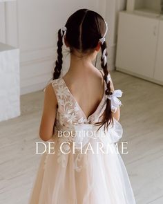 Dress your little one in timeless elegance with our beautiful girl's dress, perfect for special occasions. The top features a delicate lace bodice and a long tulle skirt. This sleeveless design comes with a scoop neckline and a V-shaped back for added sophistication. Intricate lace details flow from the bodice to the skirt, with a charming tulle bow at the waist. Airy tulle bows adorn the shoulder straps, adding a whimsical touch. For extra flair, a detachable tulle train can be added for an add Flower Girl Dresses With Flowers, Rustic Flower Girl Dress, Tulle Train, Sleeveless Flower Girl Dresses, Flower Girl Gown, Lace Flower Girl Dress, Holy Communion Dresses, Girls Ball Gown, Rustic Flower Girls