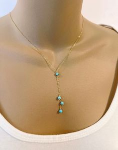 Dainty Turquoise Bead Lariat Necklace Simple necklace is composed of delicate cable chain with 4mm genuine turquoise beads and spring ring closure. All metal components are 14K gold filled, rose gold filled or sterling silver.  The lengths listed are excluding the drop (chain going around the neck to the Y).  The drop at the Y is an additional 2 inches. CUSTOM REQUESTS ARE ALWAYS WELCOME! ~ Feel free to message me if you have any questions or special requests ... I will do my best to accommodate Turquoise Drop Necklace, Pearl And Turquoise Necklace, Adjustable Turquoise Elegant Lariat Necklace, Turquoise Beaded Dangle Lariat Necklace, Turquoise Lariat Necklace Gift, Turquoise Lariat Necklace As A Gift, Elegant Turquoise Beaded Lariat Necklace, Turquoise Lariat Necklace With Adjustable Chain, Adjustable Turquoise Jewelry With Delicate Chain