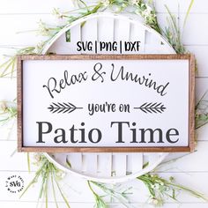 a sign that says relax and unwind you're on patio time