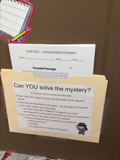 a sign posted on the back of a refrigerator that says can you solve the mystery?