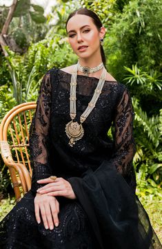 Elegant Black Embroidered Chiffon Pakistani Salwar Kameez with Dupatta is a stunning ensemble adorned with exquisite floral embroidered creating a timeless design. Intricate designs and fine details of thread make this beautiful Pakistani Salwar Suit an epitome of beauty and whimsical grace. Embroidered Kameez: The perfectly crafted kameez is adorned with intricate embroidery on the front, and sleeves making the elegant design. The neckline and sleeves are alluring with embroidered patch details Elegant Kundan Sharara For Transitional Seasons, Elegant Georgette Churidar With Intricate Embroidery, Black Chikankari Embroidery Sets For Reception, Black Sets With Chikankari Embroidery For Reception, Elegant Kundan Sharara With Intricate Embroidery, Traditional Churidar With Sheer Dupatta For Reception, Elegant Floor-length Anarkali Set, Elegant Kundan Traditional Wear With Resham Embroidery, Reception Georgette Churidar With Chikankari Embroidery