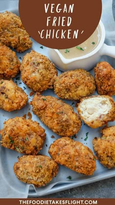 chicken nuggies on a platter with ranch dressing in the background and text overlay that reads vegan fried chicken