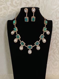 This exquisite Victorian-style ad necklace showcases intricate craftsmanship, blending traditional Indian and Victorian elements. Elegant Emerald Necklace With Stone Work, Traditional Stone Setting Necklaces For Formal Occasions, Traditional Formal Necklace With Stone Setting, Traditional Formal Necklaces With Stone Setting, Elegant Necklace With Stone Work For Festive Occasions, Festive Pendant Necklace With Stone Setting, Kundan Long Necklace For Party, Elegant Bridal Necklace With Stone Work Pendant, Elegant Bridal Pendant Necklace With Stone Work