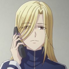 a blonde haired woman talking on a cell phone