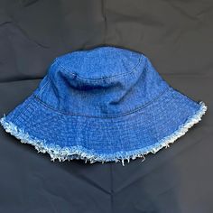 One Size Denim Distressed Bucket Hat. Never Worn Summer Beach Washed Bucket Hat, Summer Beach Bucket Hat Washed, Distressed Beach Hat For Summer, Distressed Hats For Beach In Summer, Distressed Summer Beach Hats, Casual Cotton Sun Hat One Size, Casual Cotton Sun Hat, Bohemian Distressed Summer Hats, Summer Distressed Adjustable Bucket Hat