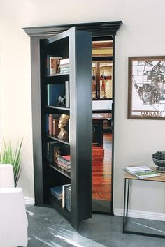 an open book case in the corner of a room