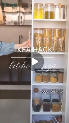 a woman standing in front of a kitchen pantry filled with food