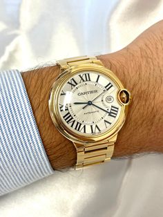 Cartier Jumbo Ballon Bleu 42mm in 18K Yellow Gold with Box & Papers, Cartier Ballon Bleu Large Men's Watch Ref. 2998 | Full Set  Cartier Jumbo reference 2998 large-size 42mm men's wristwatch set in 18 karat solid yellow gold. Blue sword-shaped hands and a sunken date function at the 3 o'clock position. 42mm Case with Cartier signature reference and serial numbers on the case back. Roman Numeral dial with silver guilloché opaline. Water Resistance: 3 ATM (approx. 30 meters/100 feet). Swiss-made a Cartier Watches Mens, Yellow Watches, Jewelry Product Shots, Bezel Bracelet, Signature Stamp, Cartier Ballon Bleu, Cartier Watch, Cartier Men, Large Man