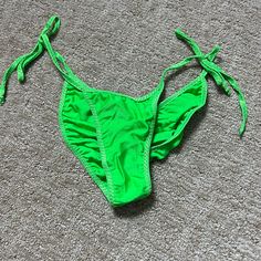 Nwot Neon Green Scrunch Bikini Bottoms, Great For Dancing Or For The Beach. Best Fit For A Size Small Or Medium, Adjustable And Brand New, Never Worn! Green Stretch T-back Swimwear, Stretch T-back Bottoms For Beach, Summer T-back Bottoms For Sunbathing, Stretch Swimwear With Drawstring For Sunbathing, Stretch Drawstring Swimwear For Beach Season, Stretch Swimwear With Drawstring For Beach Season, Stretch Drawstring Bottoms For Beach Party, Stretch Swimwear With Drawstring For Pool, Green Triangle Top Swimwear With Drawstring