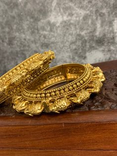 Gold plated temple style bahubali .bangles Both bangles are openable style. Rounded inside for total comfort. They run a little big on the size. Comes in a pair. Heavy Bangle For Navratri, Heavy Gold Bracelets For Navratri, Gold Bangle For Navratri, Gold Bracelets For Navratri, Heavy Temple Jewelry Bangle For Navratri, Temple Jewelry Bangle For Navratri Ceremonial, Traditional Heavy Bangle For Navratri, Heavy Bangle For Diwali Ceremonial Occasion, Ceremonial Temple Jewelry Bangle For Navratri