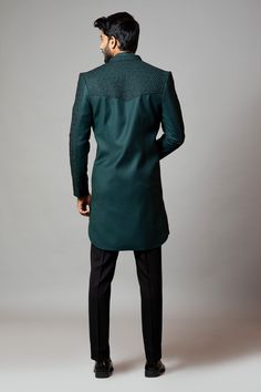 Emerald green straight-cut sherwani with honeycomb motif all-over cutdana work. Comes with short kurta and slim fit contrast trousers.
Component: 3
Embroidered
Neckline: Mandarin Collar
Sleeve Length: Sherwani: Full
Fabric: Sherwani: Suiting; Kurta: Linen; Trousers: Suiting
Color: Green
Concealed placket kurta
Seam pockets - Aza Fashions Green Unstitched Suit With Dabka Work For Formal Occasions, Green Bandhgala With Dabka Work And Traditional Drape, Elegant Green Semi-formal Kurta, Unstitched Green Formal Suit, Fitted Green Bandhgala With Resham Embroidery, Fitted Green Suits For Eid, Green Sets For Groom On Eid, Green Sets For Groom For Eid, Pista Green Sherwani With Chikankari Embroidery For Formal Occasions