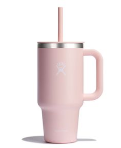 a pink tumbler cup with a straw sticking out of it's handle and lid