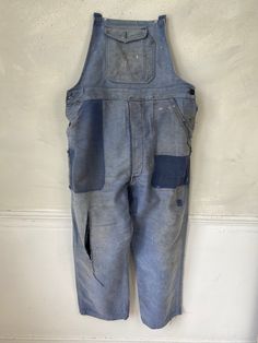 Hello and welcome to the Textile Trunk! Please follow us on Instagram, we are @textiletrunk As hipster as they get! Rustic, primitive wear ~ This textile is a lovely pair of vintage French overalls!! The top straps are all missing, but these are still a lovely treat! Made from a beautiful heavy weight indigo denim moleskin! ~~ These overalls date to the 1940s or a bit earlier~ There are two front pockets at the waist, and a button pocket on the bib. ~ lovely for creative hands to add some straps Retro Blue Jeans With Pockets, Indigo Cotton Overalls With Pockets, Blue Stonewashed Cotton Jeans, Vintage Washed Cotton Overalls, Vintage Denim Blue Overalls, Vintage Cotton Jeans Pre-washed, Vintage Cotton Jeans With Pockets, Vintage Dark Wash Bottoms With Patch Pockets, Vintage Indigo Bottoms With Pockets