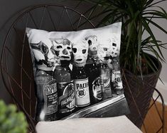 a black and white photo of beer cans on a pillow