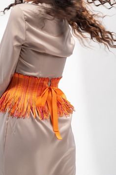 "Upgrade your style statement with this trendy handmade high and wide waist orange corset belt for women. Made with quality fabric, this belt boasts a unique fringe texture material that adds an edge to your look. The high-waist design provides excellent support and cinches your waist to enhance your curves, making it a perfect fit for any body type.  Specification: - Waist Measurements (in inches): 24 | 25 | 26 | 27 | 28 | 29 | 30 | 31 | 32 | 33 | 34 | 35 | Custom (any plus size). - Model waist Orange Color Shades, Orange Belt, Under Bust Corset, Custom Belt, Beautiful Belts, Style Steal, Corset Belt, Underbust Corset, Suspender Belt