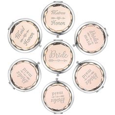 four compact mirrors with different names on them