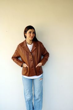 "Beautiful and full of character vintage brown leather jacket nicely broken in and somewhat distressed- general wear and fading, soft leather, buttons down the front, pockets, fully lined, condition issue in the form of General wear and some fading color on the shoulder and edges of the sleeves. otherwise, good vintage condition. ** Model is 5'7\" and size small for reference. ** Approximate size:  S/M- Please refer to the measurements. M E A S U R E M E N T S -were taken with garments laying fl Vintage Distressed Brown Leather Jacket, Brown Leather Button-up Blazer, Brown Button-up Leather Jacket For Fall, Brown Casual Leather Jacket With Snap Buttons, Brown Leather Jacket With Buttons For Fall, Brown Leather Jacket With Button Closure For Fall, Casual Brown Leather Jacket With Snap Buttons, Casual Brown Leather Blazer, Distressed Brown Long Sleeve Leather Jacket For Fall