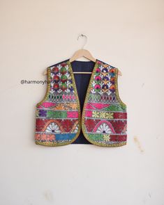 HARMONYHANDICRAFTCO presenting beautiful vintage banjara vest, It's reversible jacket which means you can wear this by both side.  Buy it for the holidays! Looks fabulous over a long silk tank dress or palazzo pants. Or wear it with jeans and boots. The design of the jacket is very unique and very rare. Indian culture and associated with grace and beauty. This Is A Gorgeous Piece Of Cotton Kantha Stitched jacket. Perfect Gifts For Your Beloved.. What Are You Waiting For? Add This Item To Cart, Buy Now And Surprise Your Loved Ones! Measurements Approx : S/M Length - 18 Inches Chest - 38 Inches Shoulder - 14.5 Inches Fabric - 100% Cotton Banjara vest, banjara sleeveless jacket, quilted vest, quilted jacket,embroidery vest, Indian kantha jacket, Kantha waistcoat, Reversible kantha jacket boho Vest Handmade, Jacket Embroidery, Silk Tank Dress, Boho Vest, Kantha Jacket, Boho Jacket, Reversible Vest, Embroidery Motifs, Sleeveless Jacket