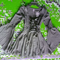 Brand New With Tags! The Grave Girls Casting Spells Chiffon Mini Dress - This Chiffon Mini Dress Has A Square Neckline, Bell Sleeves, And A Lace Up Front With Adjustable Ribbon Ties. Open To Offers Casting Spells, Goth Gf, Chiffon Mini Dress, Ribbon Tie, Square Necklines, Dolls Kill, Square Neckline, Chiffon Dress, Bell Sleeves