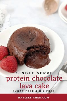 a chocolate lava cake on a plate with raspberries next to it and the words, single serve protein chocolate lava cake