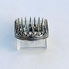 This ring looks like it is from a movie. I love that from every direction there is spikes around my finger. A sudtle warning perhaps to not cross that line. A land where anything is possible but you may get impaled for attempting to enter. This spikes all around me and my heart ring is available in sizes 6-10 in silver. Thank you so much. I do make AFFORDABLE custom pieces of mourning jewelry for those who have lost someone. I have been actively making feretories, aka reliquaries for myself and Cinderella Ring, Gothic City, Castle Ring, Oregon House, Lost Someone, Spike Ring, Fairytale Castle, Green Amethyst, Recycled Sterling Silver