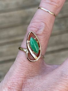 Jade measures 10mm x 4mm. The ring weighs 2.4g and measures 16.25mm at its widest point. It is stamped 14k yellow gold. Ring size is 4 and sizable. I can size it for an additional charge. Let me know if you need a quote. Gold Marquise Emerald Ring In 14k Gold, Green Marquise 14k Gold Ring, Green Marquise Ring In 14k Gold, Marquise Green Ring In 14k Gold, Heirloom Marquise Emerald Ring In 14k Gold, Solitaire Ring, Rings Statement, Gold Ring, Statement Rings