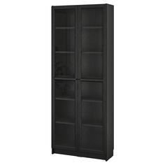 a tall black bookcase with glass doors