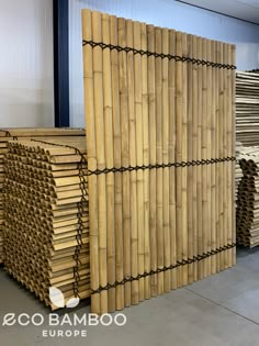 several stacks of bamboo sticks stacked on top of each other