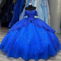 a blue ball gown on display in a store