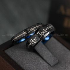 two rings with the words he and her engraved on them