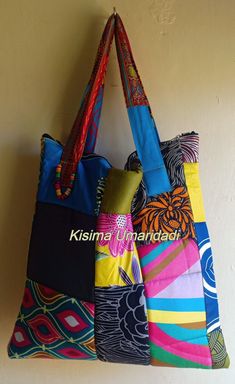 This bag is made by patching together different pieces of colorful of Kitenge fabric. The uniqueness in this bag is that none looks like the other. Inside the bag is not partitioned. Its light in weight and easy to clean. Machine and hand washable. Multicolor Upcycled Tote Bag, Upcycled Multicolor Tote Bag, Everyday Fabric Shoulder Bag With Patchwork, Multicolor Upcycled Tote Shoulder Bag, Daily Use Fabric Shoulder Bag With Patchwork, Fabric Patchwork Shoulder Bag For Daily Use, Colorful Patchwork Shoulder Bag For Daily Use, Colorful Patchwork Shoulder Bag For Everyday Use, Multicolor Cotton Patchwork Bags