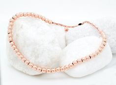 "For a charming addition to her collection, consider this 14k rose gold plated beaded ball bracelet, perfect for stacking and layering. Whether as bridesmaid jewelry or a thoughtful gift idea for her, it exudes dainty elegance, ideal for those who appreciate delicate bead jewelry. 𝐃𝐄𝐓𝐀𝐈𝐋𝐒 💎 1 bracelet, included 💎 Material: Sterling Silver, 14k Rose Gold Plated 💎 2mm: bead size 💎 Adjustable 𝐇𝐎𝐖 𝐓𝐎 𝐎𝐑𝐃𝐄𝐑 1. Select the color of the bracelet 2. Select the thickness 3. Select des Dainty Rose Gold Bracelets With Round Beads, Stackable Round Beads Bracelets In Rose Gold, Hypoallergenic Rose Gold Bracelet With Round Beads, Stackable Rose Gold Beaded Bracelets, Rose Gold Stackable Beaded Bracelets, Dainty Rose Gold Stackable Bracelets, Hypoallergenic Dainty Rose Gold Beaded Bracelets, Round Hypoallergenic Rose Gold Bracelets, Hypoallergenic Round Rose Gold Bracelets